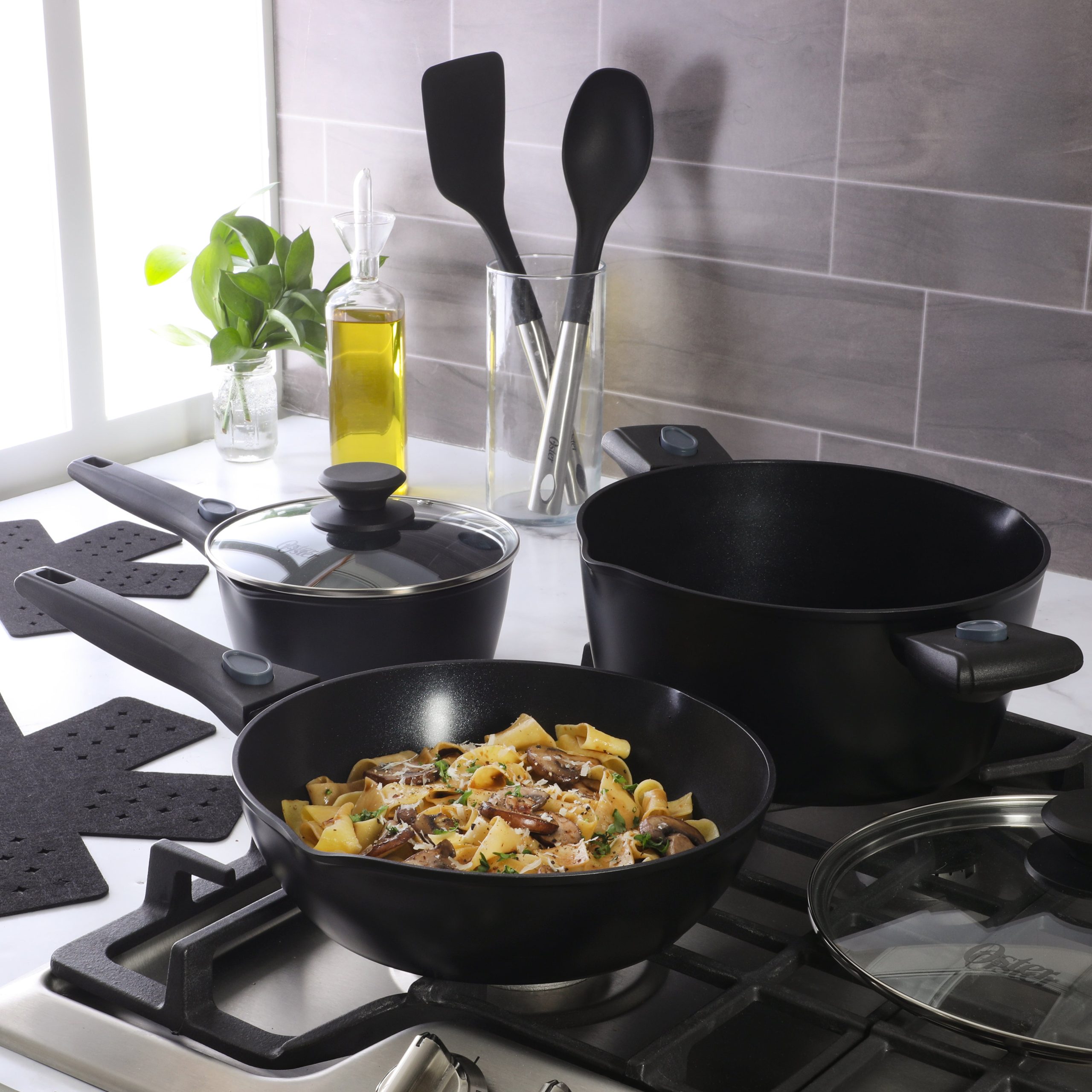 Oster SmartHandle Advance 13-Piece Nonstick Cookware Set – Matte Black Finish, Induction Base, Detachable Handles, Forged Aluminum, Oven & Dishwasher Safe, With Utensils & Pan Protectors - Image 3