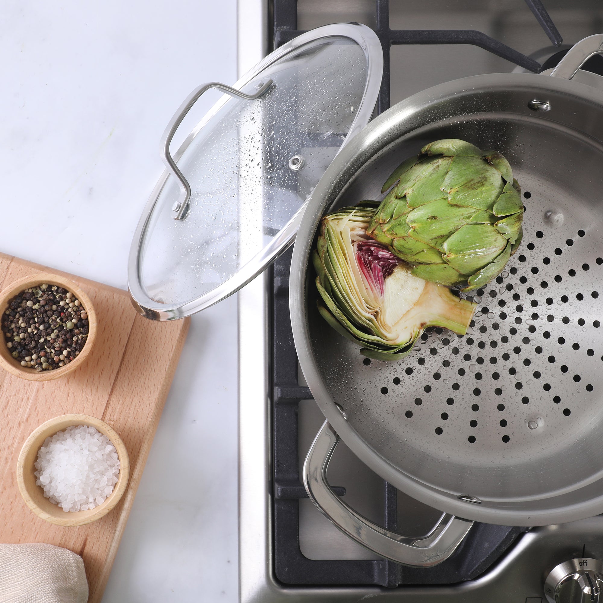 Sur La Table Kitchen Essentials Chef's Deck 3-Piece 5.3-Quart Stainless Steel Dutch Oven with Steamer Insert & Glass Lid – Induction Ready, Tri-Ply Base, Polished Finish & Hollow Stay-Cool Handles - Image 2